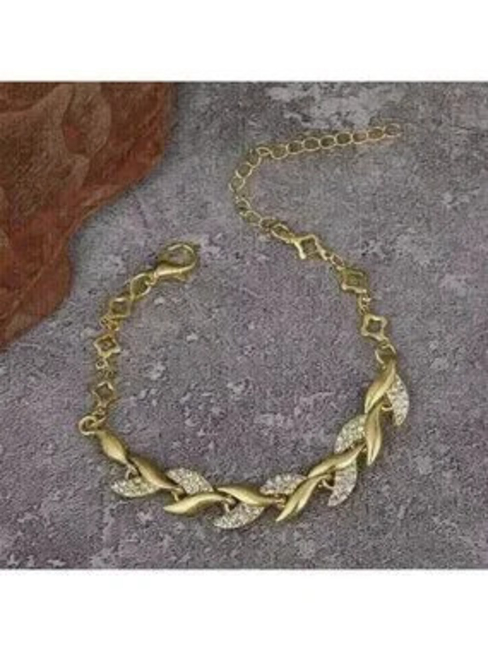 Gold Leaf Bracelet: An elegant bracelet featuring leaf-shaped